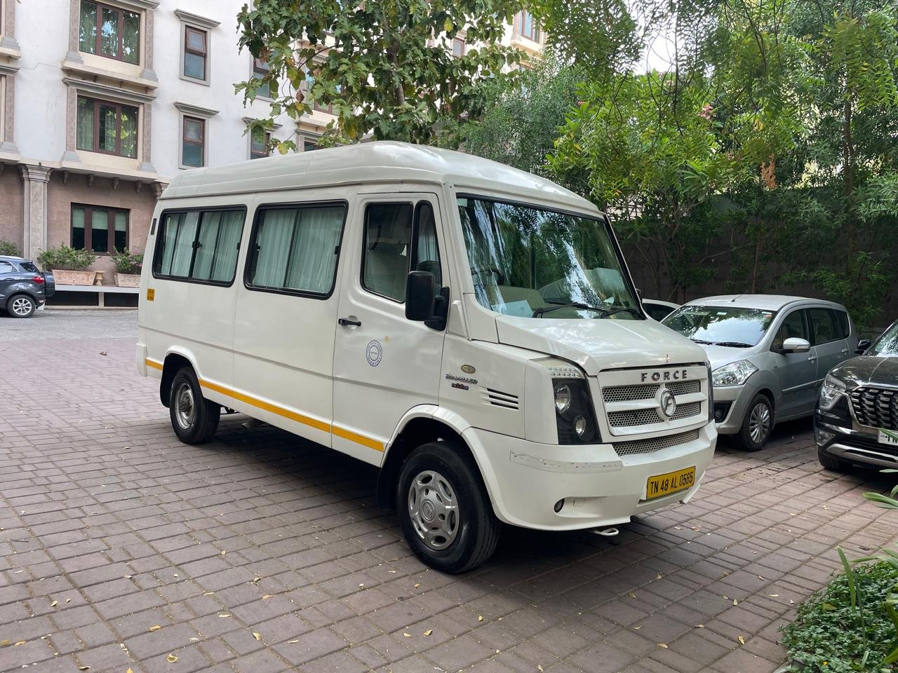 RR Tours and Travels sedan parked outside the Madurai office